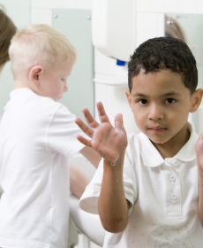 kids washing hands in restroom